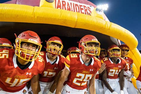 Jesuit football pulls off win despite the loss of their starting ...