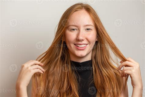 Portrait Of Beautiful Cheerful Redhead Girl Smiling Laughing Looking At