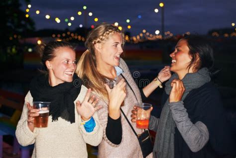 Partying Under The Stars Three Friends Talking And Drinking At Night