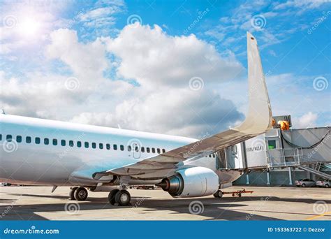 Passenger Aircraft Parked At The Terminal Flight Service Stock Photo