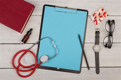 Premium Photo Blank Clipboard Pills Book Stethoscope Eyeglasses And