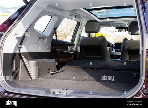 a huge car interior with the rear seats folded down. large luggage compartment of a family car ...