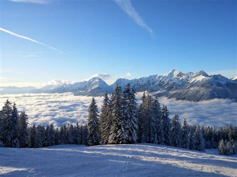 tyrol austria mountains forests grasslands alps clouds