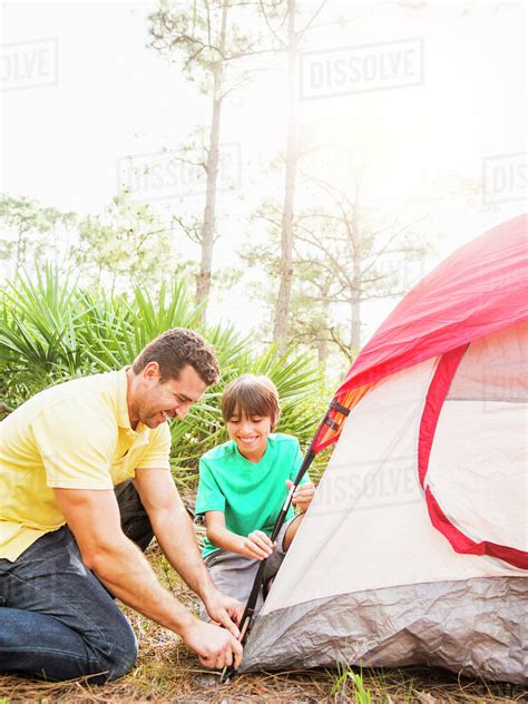 Father And Son 12 13 Setting Up Tent Stock Photo Dissolve