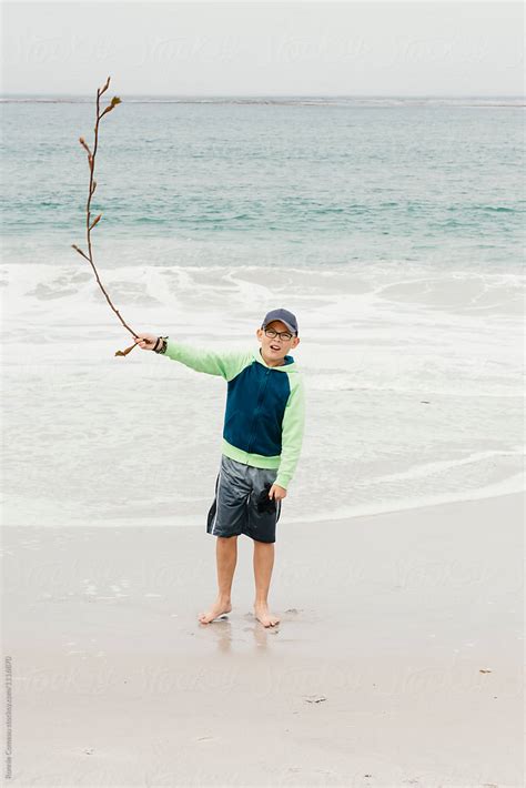 Boy With Seaweed Whip By Stocksy Contributor Ronnie Comeau Stocksy