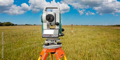 Cartography Theodolite On The Background Of A Topographic Map