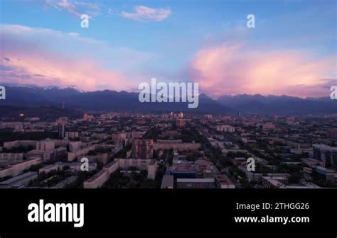 Pink Blue Large Clouds Over The City Of Almaty And The Mountains Top