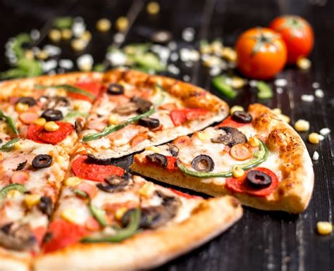 Free Photo Close Up Of Pepperoni Pizza Slices With Sausages Mushroom