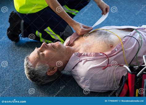 Paramedic Using An External Defibrillator During Cardiopulmonary