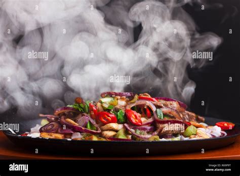 Steaming Chicken Sizzler With Noodles Stock Photo Alamy