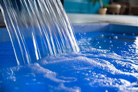 Close-up of a Waterfall of Blue Water in an Indoor Pool Stock Photo ...