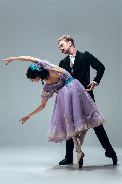 Contemporary Ballroom Dancers On Grey Studio Background Stock Photo