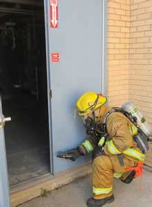 Firefighter Using A Gas Meter