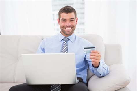 Premium Photo | Happy businessman using his laptop