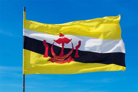 Premium Photo Flag Of Brunei Darussalam On Blue Sky Background