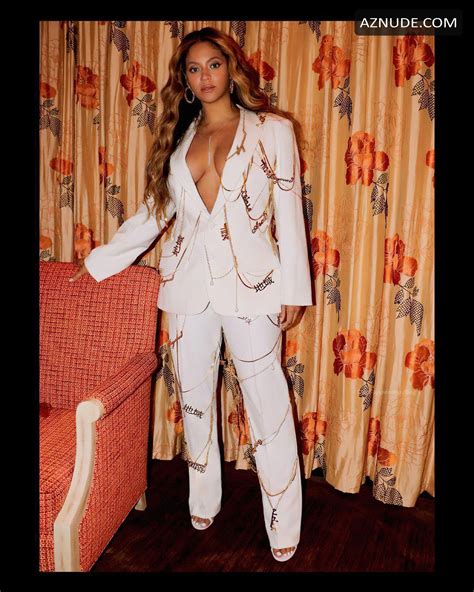 Beyonce Sexy Shows Off Her Cleavage Posing Braless In A White Pantsuit