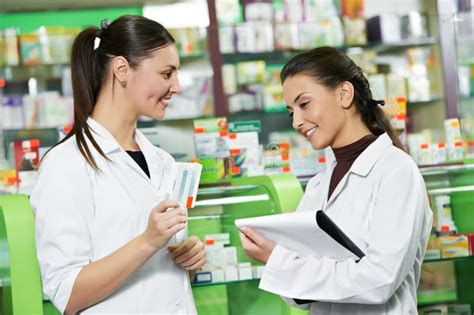 Pharmacy Chemist Women In Drugstore Stock Photo Image