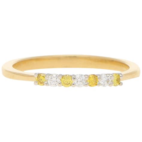 White And Natural Yellow Diamond Half Eternity Ring Set In 18 Karat