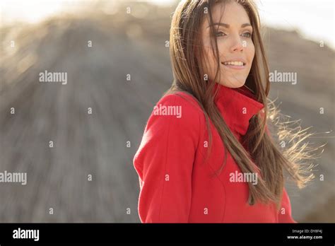 Pretty Young Woman In Red Coat Stock Photo Alamy