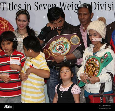 Filipino Boxing Great Manny Pacquiao And His Mother Dionesia Hold His