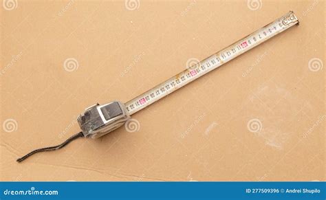 Measuring Tape On A Cardboard Background Close Up Stock Photo Image