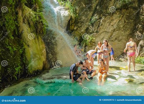 Deep Forest Waterfall With Tourist In Erawan National Park Kanchanaburi