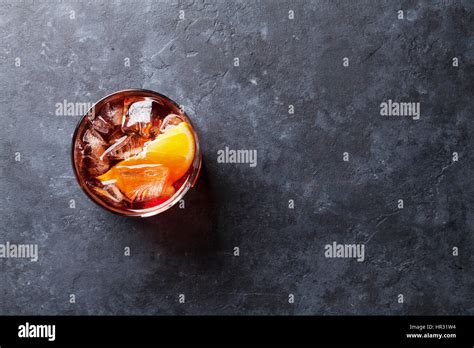 Negroni Cocktail On Dark Stone Table Top View With Space For Your Text