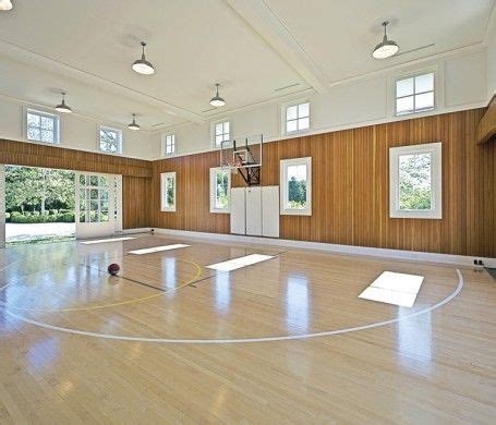 A Light Filled Basketball Gym Features Eastern White Maple Floor