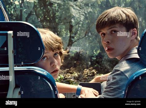 TY SIMPKINS, NICK ROBINSON, JURASSIC WORLD, 2015 Stock Photo - Alamy