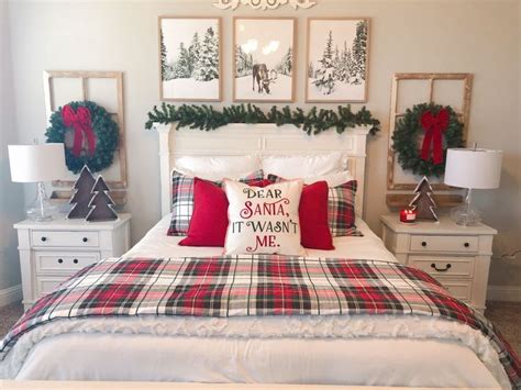 A Bedroom Decorated For Christmas With Plaid Bedding And Red Pillows