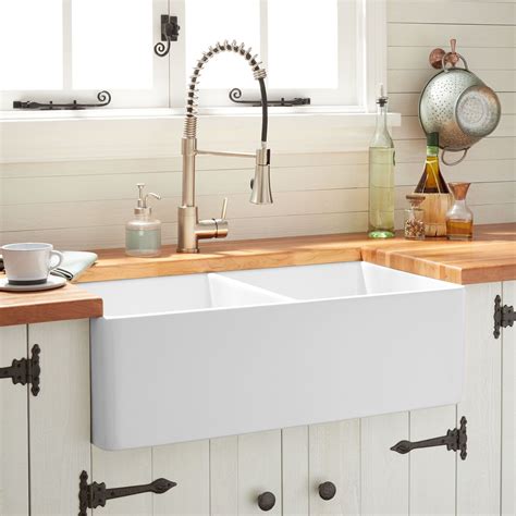 The 33" Reinhard Double-Bowl Fireclay Farmhouse Sink is a beautiful and ...