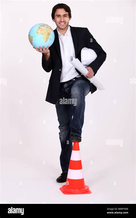 Architect holding globe Stock Photo - Alamy