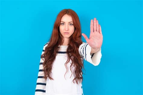 Premium Photo Model Doing Stop Gesture With Palm Of The Hand Warning