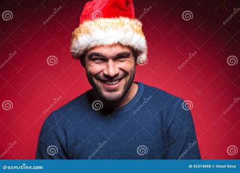 Young Man Wearing A Red Santa Hat Smiling Stock Photo Image Of