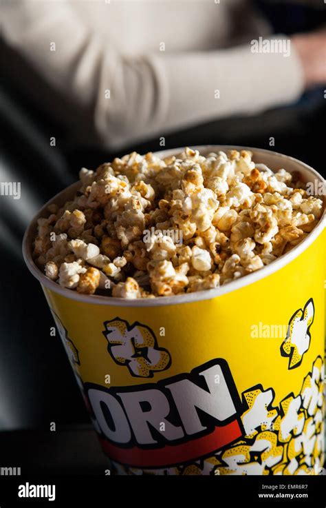 Popcorn Bucket In Cinema Theater Stock Photo - Alamy