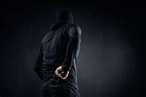 Thief Hiding Gun Behind His Back — Theft Safe Stock Photo 190750280