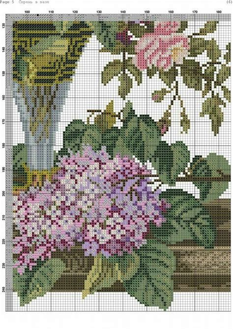 A Cross Stitch Pattern With Flowers On It