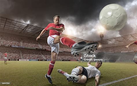 Come Up Soccer Player Kicking Football Stock Photo - Download Image Now - Soccer, Soccer Player ...