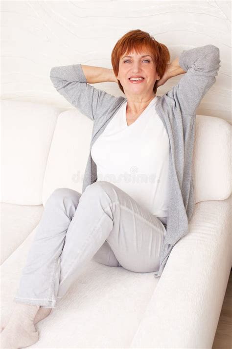 Happy Mature Woman On Sofa Stock Photo Image Of Human