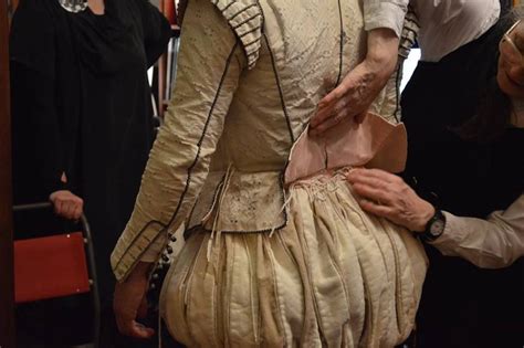 Tying Together The Doublet And Hose Around The Waist With Silk Points