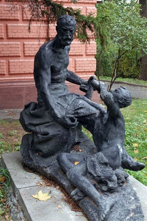 Sculpture Of Naked Men With A Machine Gun Drinking Water Editorial