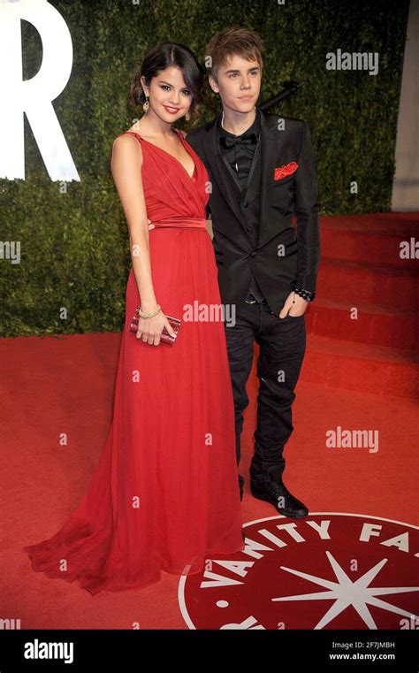 Selena Gomez And Justin Bieber At The 2011 Vanity Fair Oscar Party Hosted By Graydon Carter At