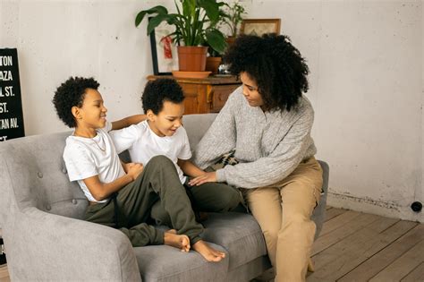 Black boy with potted plant in hands · Free Stock Photo