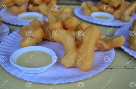 Close Up Deep Fried Dough Stick With Sweetened Condensed Milk Di Stock