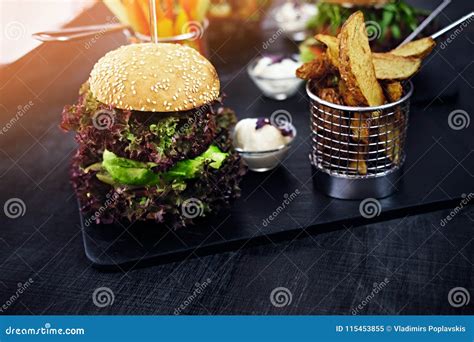 Burger Fries With Salad On A Table Stock Image Image Of Dinner