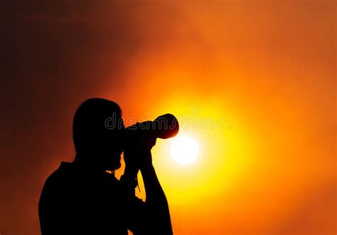 A Silhouette of a Photographer with a Camera at Sunset Stock Photo - Image of silhouette, camera ...