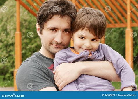 Cute Son With His Handsome Dad Portrait Outside Stock Image