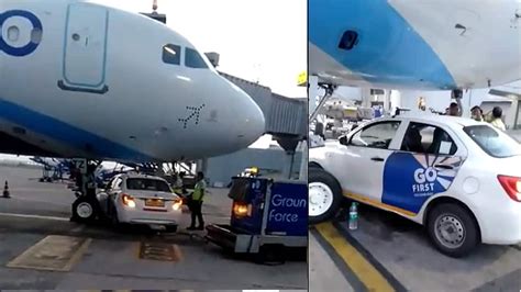 Shocking Go First Car Goes Under Indigo Plane At Delhi Airport