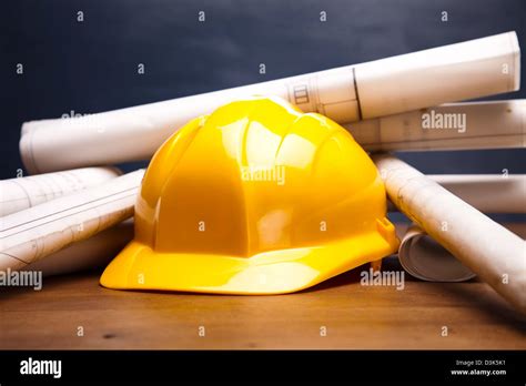 Construction Plans And Yellow Hard Hat Stock Photo Alamy