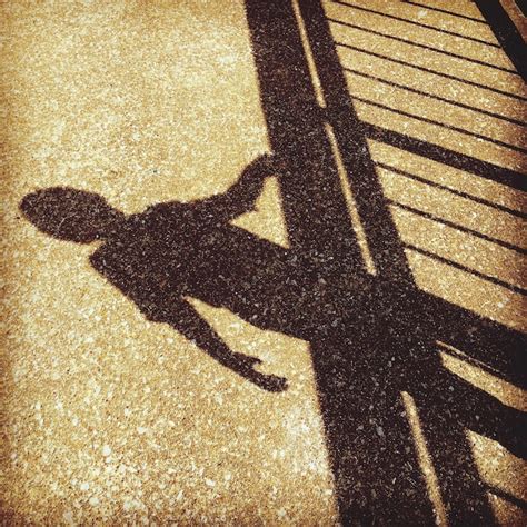 premium photo shadow  person  railing falling  ground